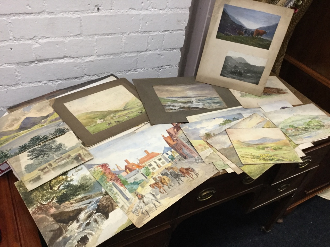 A collection of unframed nineteenth century watercolours, mainly landscapes, some signed with