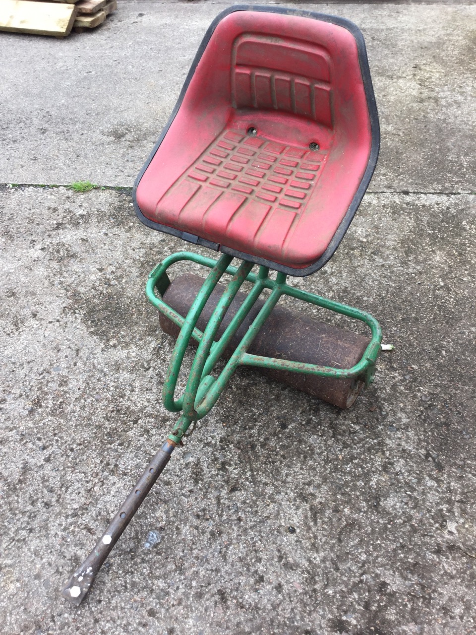 A garden mower seat with 22in twin roller, having adjustable shaft and sprung cushion chair.