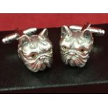 A cased pair of Sterling silver cufflinks modelled as bulldogs, inlaid with glass bead eyes,