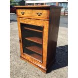 A Victorian walnut cabinet, the moulded top inlaid with boxwood & ebony band above a frieze