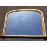 A late Victorian overmantle mirror, the moulded arched frame on plinth with rounded ends. (48in x