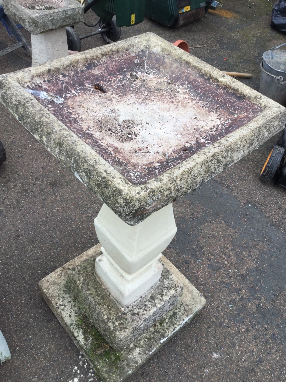 A composition stone birdbath, with square basin on later column, above a stepped plinth base. ( - Image 2 of 3