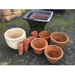 A large square tapering glazed garden urn; 21 terracotta garden pots - varying sizes; and fluted
