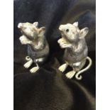 A pair of silver plated mice cruets, the salt & pepper beasts seated on their haunches in a