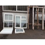 A square resin moulded shower tray - 31in x 3.5in; three Kitson UPVC framed windows; and a pair of