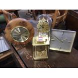 A Swiza 8 60s stylish mantleclock; a German made anniversary clock under dome; a quartz brass