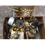 Miscellaneous brass and metalware including a set of door handles, a boxed Tilley lamp, bells, a