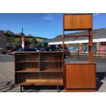 A mid-century G-plan and Beaver & Tapley teak sliding door glazed bookcase and dresser, the