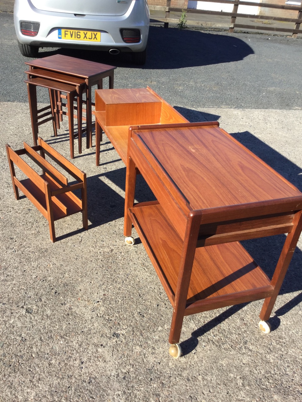 A teak trolley with tray platforms and a drawer; a teak telephone table or bench raised on square - Image 3 of 3