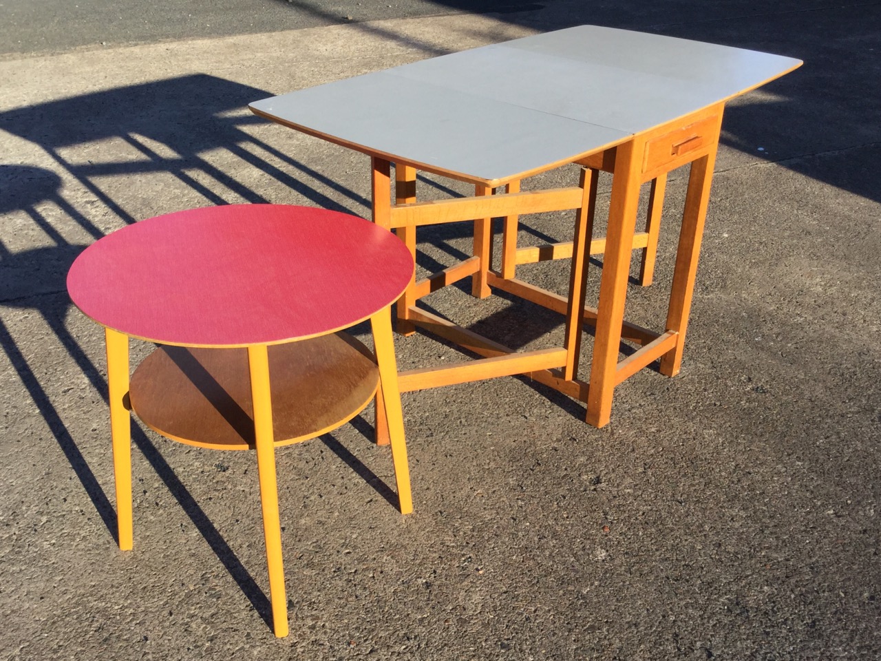 A circular formica topped table on angled rectangular tapering legs joined by platform stretcher; - Image 2 of 3