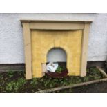 A 1950s enamelled chimneypiece, the bowfronted cast iron mantleshelf on plain jambs, enclosing a