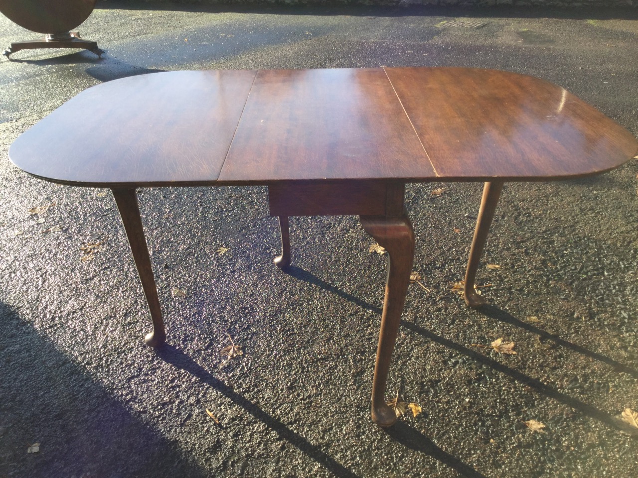 A rectangular rounded dining table, the top with drop-leaves raised on cabriole gate legs with pad - Image 2 of 3