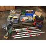 Miscellaneous boxes of tools including saws, files, a mitre saw on stand, spanners, axes, sanders,