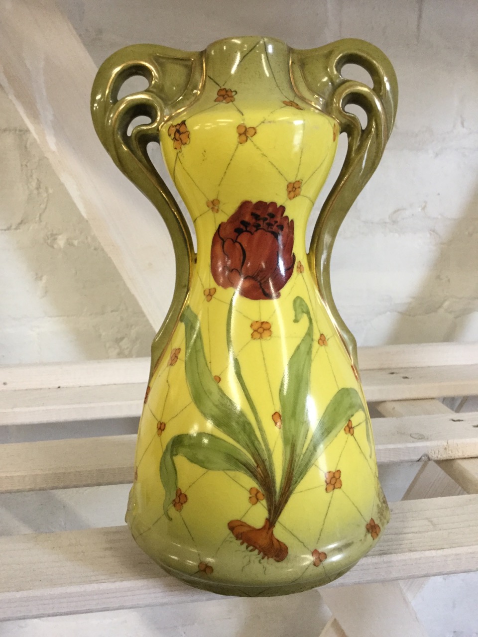 An art nouveau waisted vase with indented base having scrolled handles, painted with flowers on - Image 2 of 3