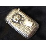 A novelty silver vesta case modelled as a cat in a basket with label reading Ready for a Scratch,