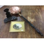 A Victorian copper bedwarming pan with ebonised turned handle; a pine country spoon rack with