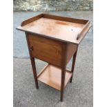 An Edwardian mahogany nightstand inlaid with satinwood banding, the rectangular top with gallery