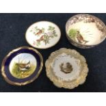 A nineteenth century Davenport plate painted with a country river landscape scene, with floral