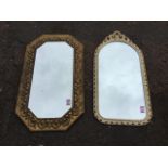 A rectangular brass framed octagonal mirror with bevelled plate in border embossed with shells