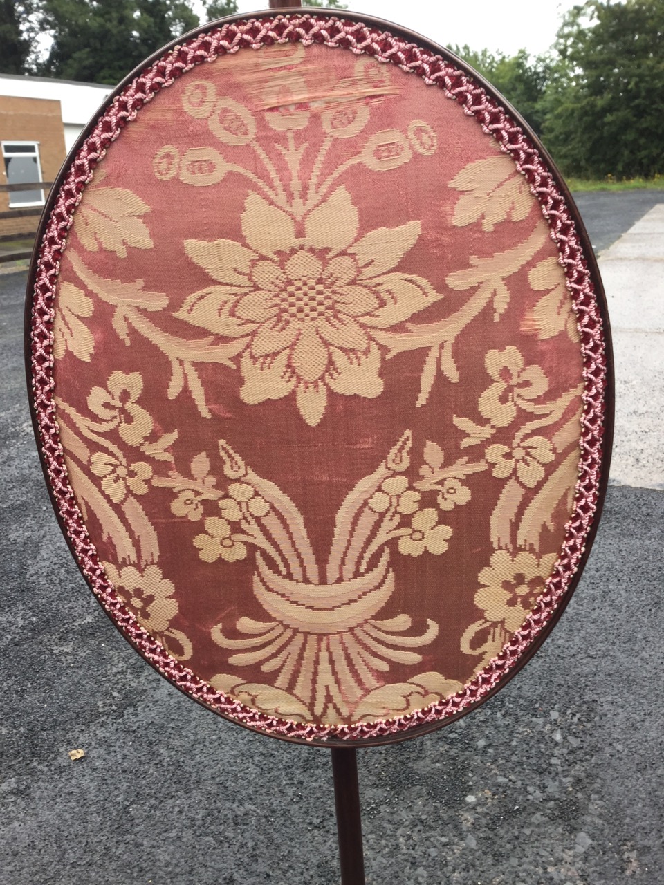 A nineteenth century mahogany pole screen with oval damask panel on turned column surmounted by - Image 2 of 3