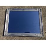 A modern rectangular mirror with bevelled plate in foliate moulded silvered frame. (36.75in x 28.