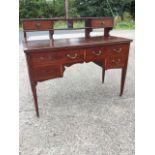 A late nineteenth century mahogany dressing table, the superstructure with two small drawers and
