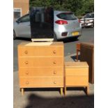 A 60s Meredew oak dressing chest with mirror above four long knobbed drawers, raised on turned