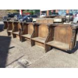 Six Victorian carved pew seats in two sections, with curved moulded backs framed by scroll carved