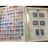 A stamp collection contained in two albums, one with almost full pages of European countries, and