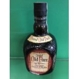 A bottle of Grand Old Parr De Luxe scotch whisky, the square mottled bottle bearing taped seal (