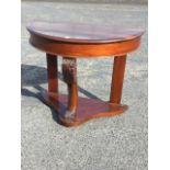 A Victorian mahogany hall table of D shaped outline, having plain frieze supported on acanthus