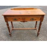 A Victorian style pine side table with rectangular moulded top above a long frieze drawer modelled