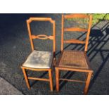 An Edwardian mahogany cane seated ladderback bedroom chair on square column legs; and another cane