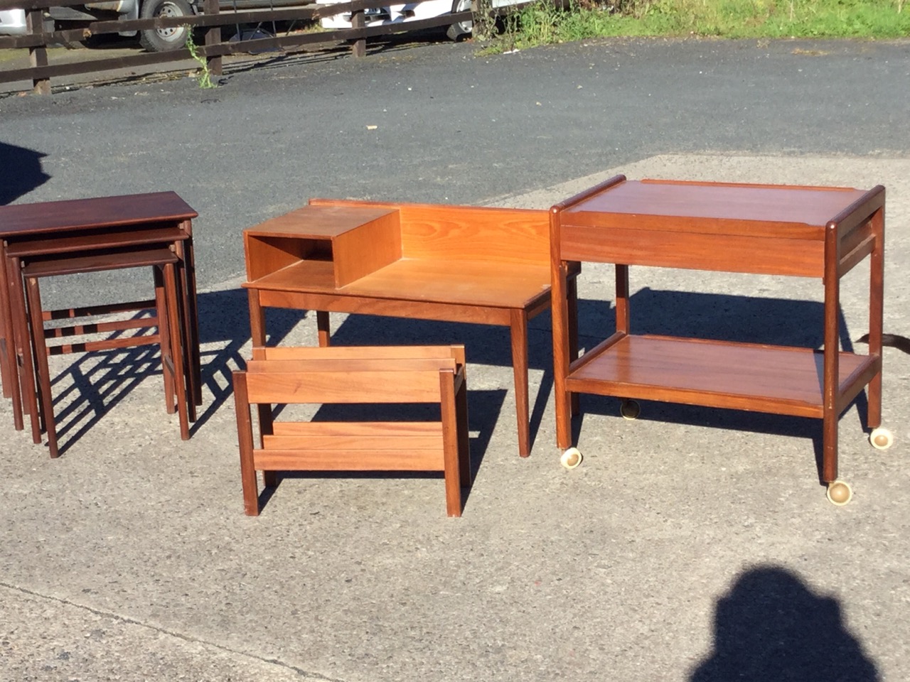 A teak trolley with tray platforms and a drawer; a teak telephone table or bench raised on square - Image 2 of 3