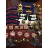 A collection of military badges, Corps of Signals, patches, buttons, Royal Artillery, elephants,