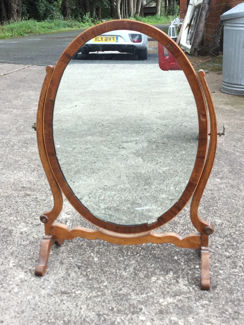 An oval nineteenth century mahogany dressing table mirror, the plate in crossbanded frame on - Image 3 of 3