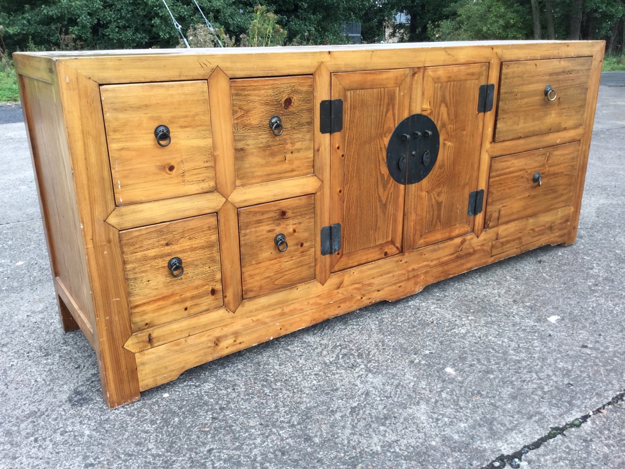 An oriental style sideboard with panelled top above central two-door cupboard mounted with - Image 2 of 3