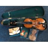 A Victorian cased fiddle, the restored instrument with single piece back, having photos of the