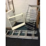 An unused wall mounting chrome designer heated towel rail with curved frame; a white melamine set of