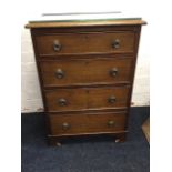 A dwarf mahogany chest of four cockbeaded drawers mounted with ring handles, having plate glass to