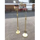 A brass standard lamp, the column mounted with four light brackets, raised on circular moulded base;