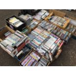 A large quantity of CDs, cassette tapes, cases full, DVDs, PlayStation games, office computer CDs,