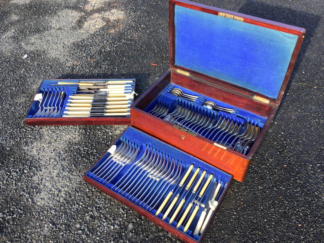 An early C20th mahogany cased canteen of silver plated Walker & Hall cutlery, the almost complete