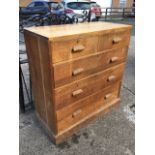 A Edwardian oak chest of drawers with two short above three long drawers mounted with rectangular
