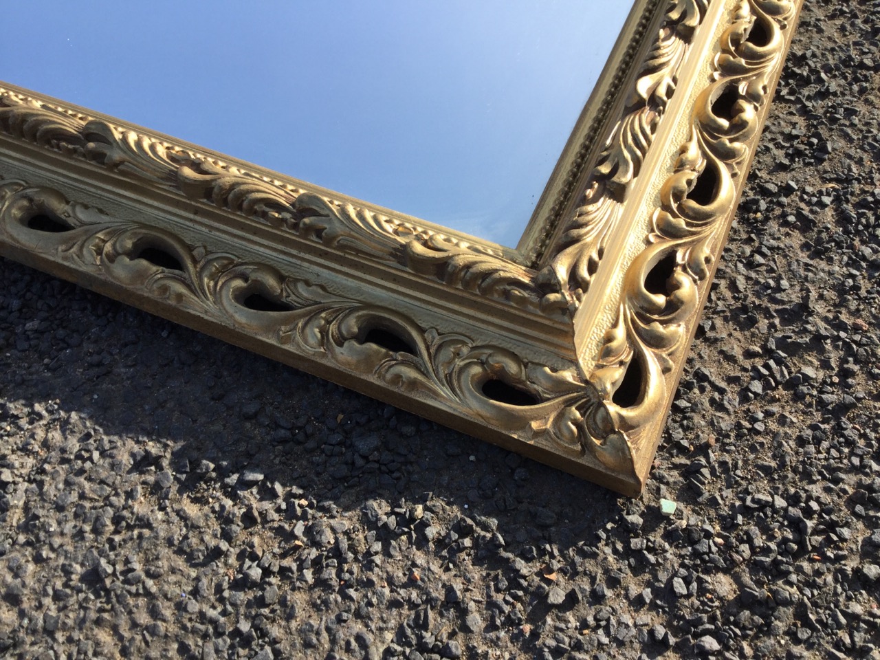 A pair of modern rectangular mirrors in pierced gilt scrolled frames with leaf mouldings and - Image 2 of 3