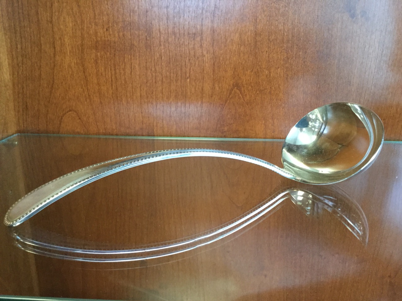 An oval silver plated ladle with bead decoration; a Victorian silver plated column candlestick - Image 2 of 3