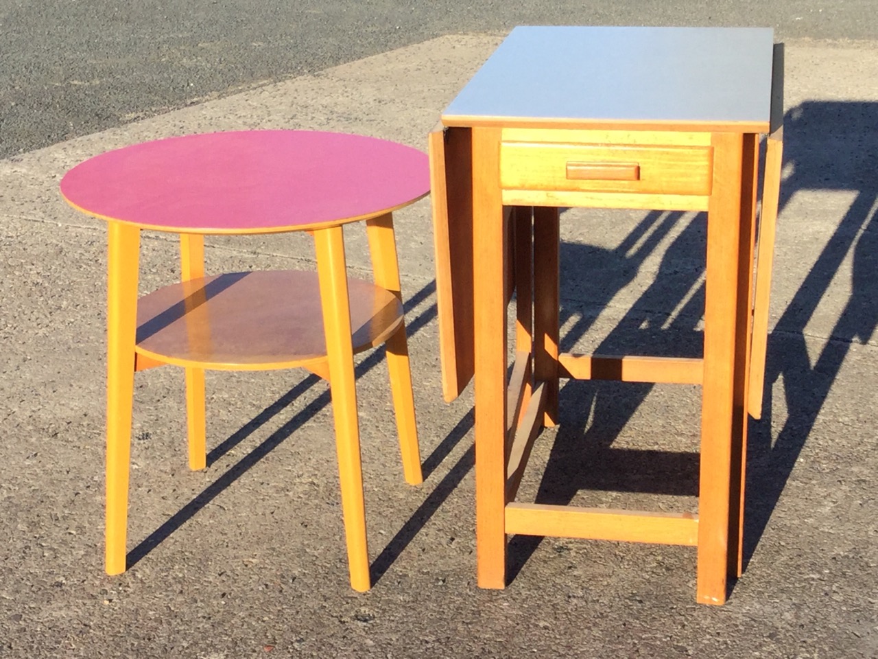 A circular formica topped table on angled rectangular tapering legs joined by platform stretcher; - Image 3 of 3