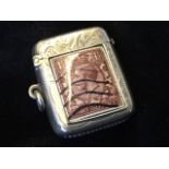 A hallmarked silver Victorian vesta case with foliate scrolled decoration having sprung hinged lid