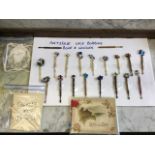 A collection of nineteenth century turned bone and hardwood lace bobbins with attached glass