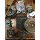 Seven fishing reels - one brass, one wood, etc; a Sunfish embossed plaque mounted on hardwood